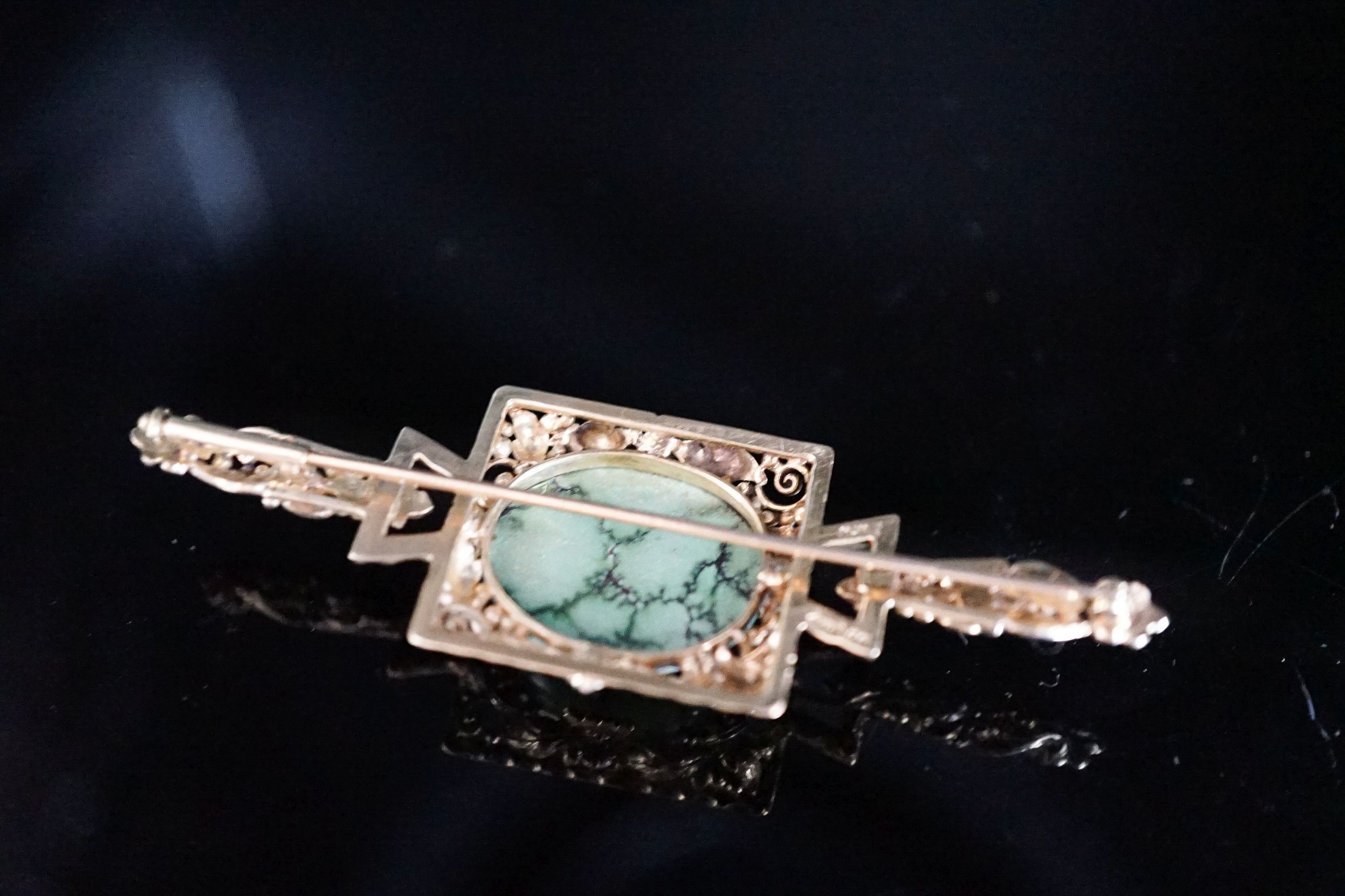 A modern 9ct gold, cabochon turquoise and four stone rose cut diamond chip set bar brooch, 67mm, 9.5 grams.